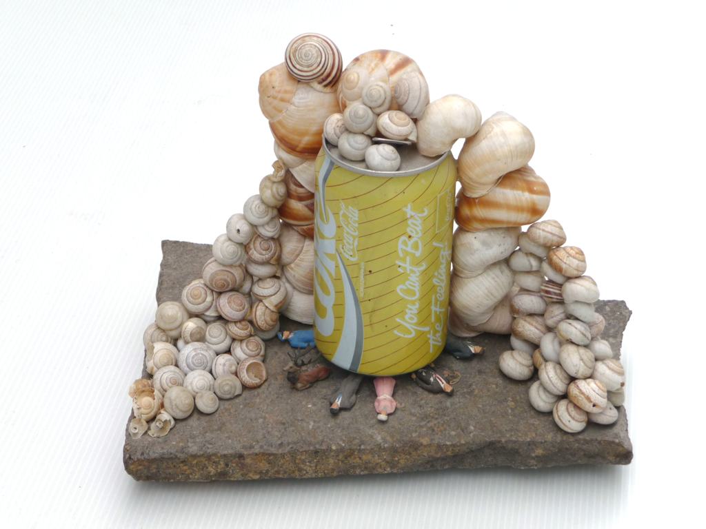 Cola snails. Tom Albrecht, 1990, Berlin, 24 x 24 x 17 cm, cola can, snail shells, model figures, stone. Sustainability for visual artists